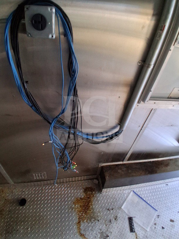 2019 Diamond Cargo 24' mobile kitchen interior with wiring and metal surfaces. Needs deep cleaning. VIN: 53NBE2422m1090404.