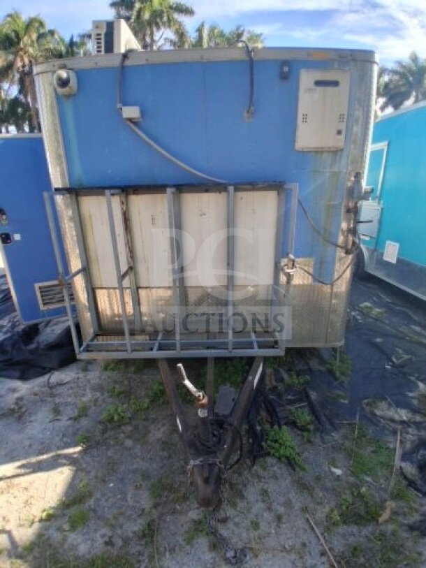 2019 Quality Cargo blue food trailer, large order window, grease hood, dual fryers, griddle, cooktop, refrigeration suite.