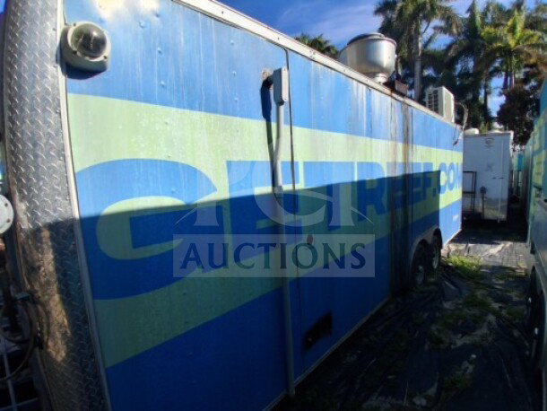 2019 Quality Cargo food trailer. Blue exterior, large order window. Equipped with grease hood, fryers, griddle, cooktop.