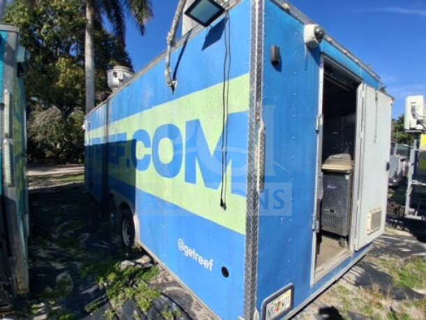 2019 Quality Cargo Food Trailer, blue exterior, large order window, equipped with grease hood, fryers, griddle, refrigeration.