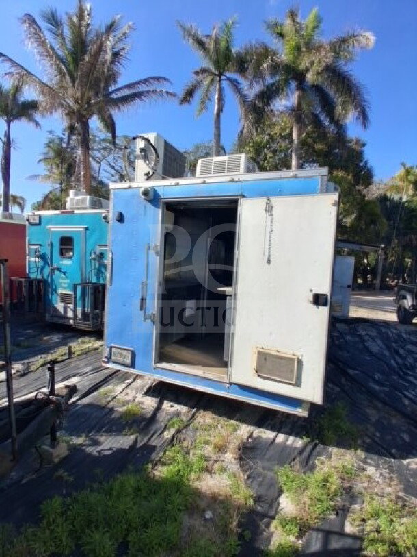 2019 Quality Cargo Food Trailer, blue exterior, commercial kitchen, large order window, equipped with grease hood, dual fryers.