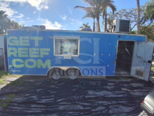 2019 Quality Cargo Food Trailer, blue exterior, large order window, equipped with grease hood, fryers, griddle, cooktop, refrigeration.