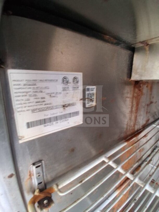 2019 Quality Cargo Food Trailer label, showing model details. Visible wear on metal surface.