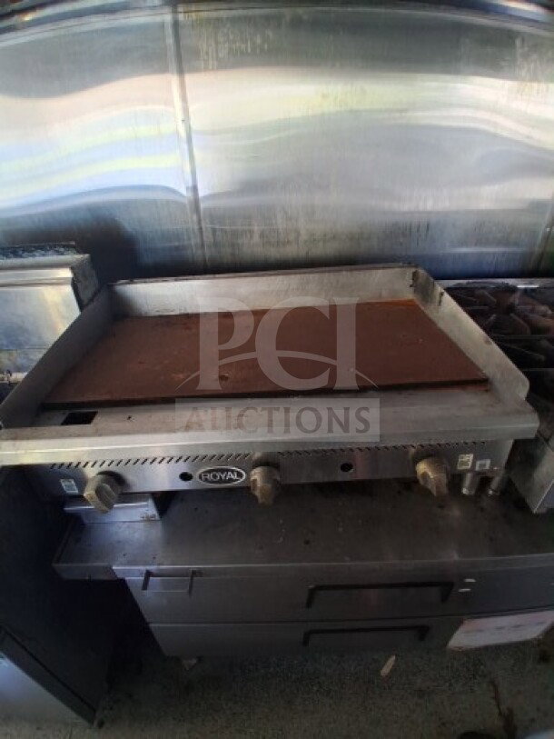 2019 Quality Cargo food trailer with griddle, dual fryers, burner cooktop, grease hood, and refrigeration suite.