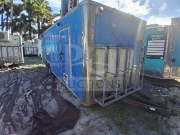 2019 Quality Cargo Food Trailer with blue exterior, large order window, grease hood, fryers, griddle, burner cooktop, refrigeration.
