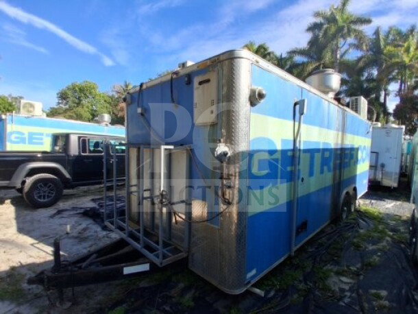 2019 Quality Cargo food trailer, commercial kitchen setup with grease hood, dual fryers, griddle, burner, and refrigeration.