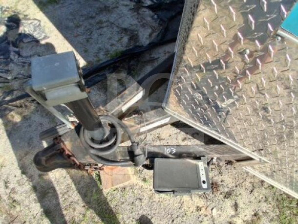 Trailer hitch and front detail of a 2018 Freedom 20' food trailer, showing diamond-pattern metal siding. VIN: 5WKBE2022J1053053.