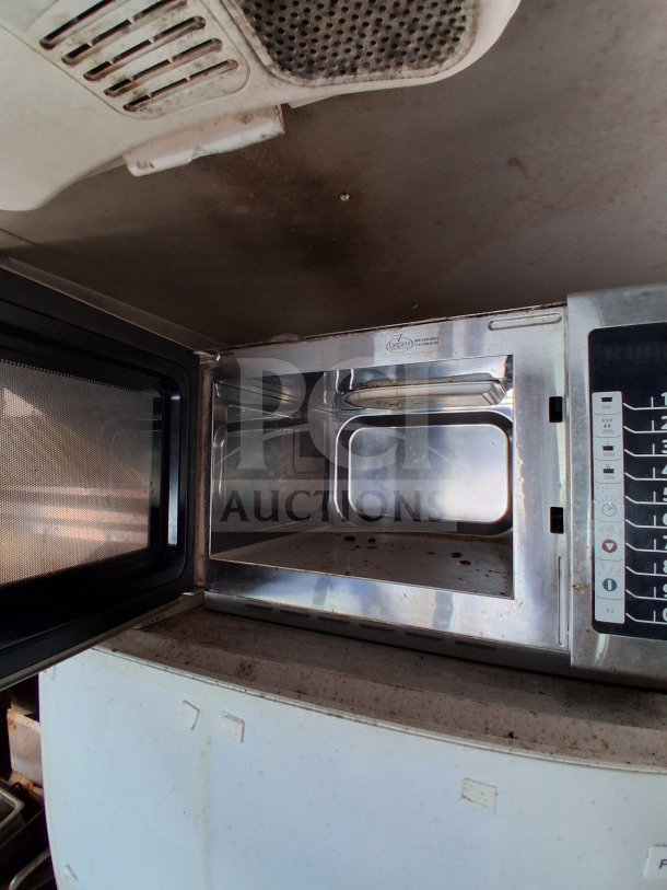 Ovention Pizza oven inside a 2018 Freedom 20' Food Trailer. Features digital controls, used condition, ideal for high-volume service.