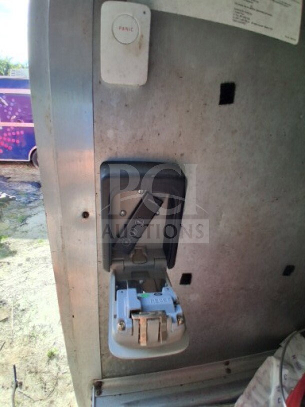 2018 Freedom 20' food trailer interior with control panel, showing wiring access and panic button. Ideal for high-volume service.