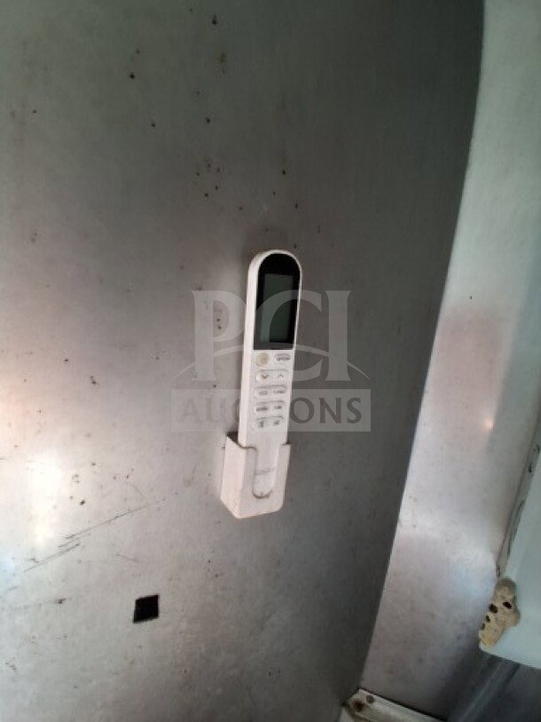 Control panel for equipment inside the 2018 Freedom 20' food trailer, mounted on a metal interior wall.
