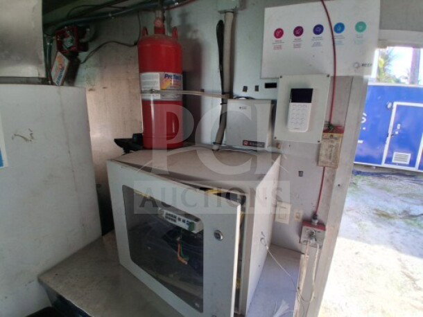 2018 Freedom 20' food trailer interior showing a Protex II fire suppression system and Ovention Pizza oven.