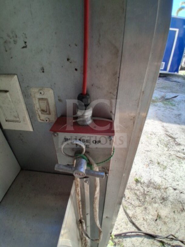 2018 Freedom 20' Food Trailer with Protex II fire suppression system lever, labeled "In Case of Fire."