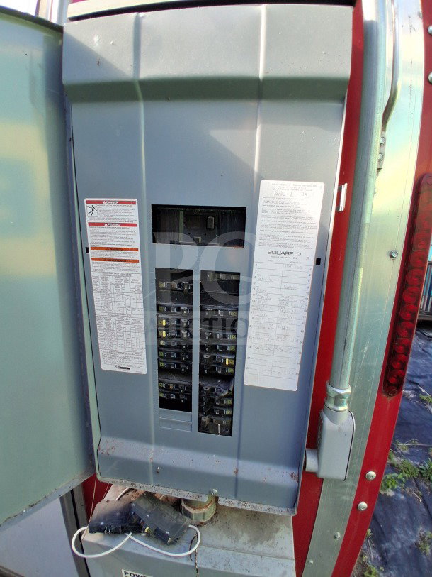 Electrical panel inside 2021 Haulmark 8.5' x 24' Mobile Kitchen Trailer; features circuit breakers and labels for functionality.