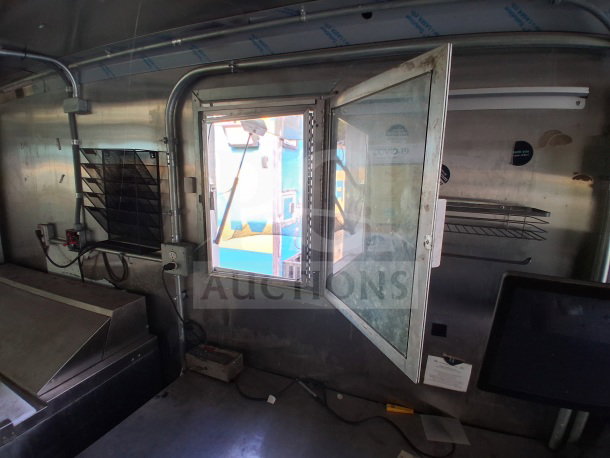 2021 Haulmark 8.5' x 24' mobile kitchen trailer interior, featuring Arctic Air units, exhaust hood, and three-compartment sink.
