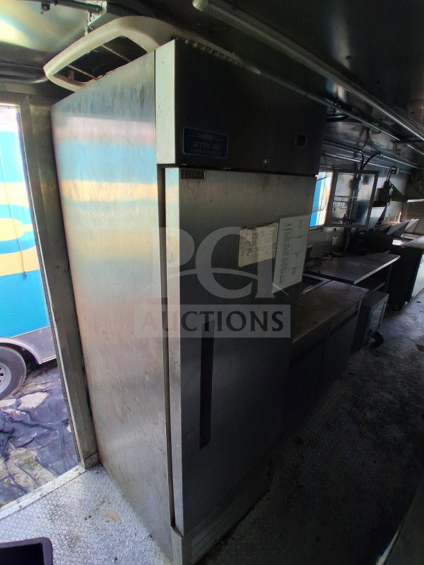 2021 Haulmark 8.5' x 24' Mobile Kitchen Trailer interior with Arctic Air refrigeration unit, exhaust hood, and sinks.