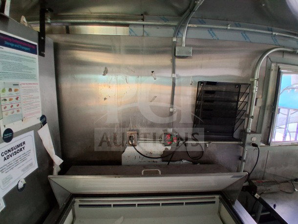 2021 Haulmark 8.5' x 24' mobile kitchen trailer interior, showing commercial-grade equipment setup. Visible advisory labels.