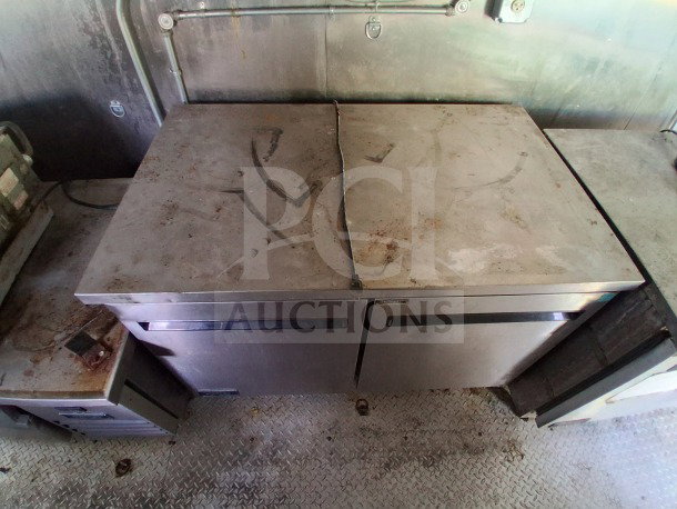 2021 Haulmark 8.5' x 24' Mobile Kitchen Trailer interior with Arctic Air refrigeration units. Slight wear visible.