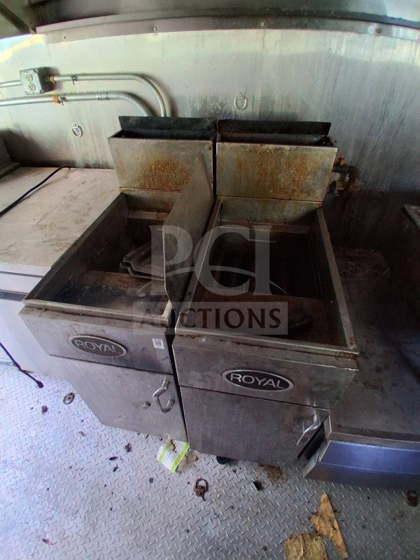 Dual fryer units in Haulmark 2021 mobile kitchen trailer, features signage with "Royal" brand, part of high-efficiency cooking line.