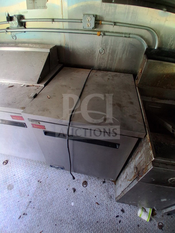 2021 Haulmark 8.5' x 24' Mobile Kitchen Trailer interior, showing Arctic Air fridge suite, and commercial-grade metal surfaces.