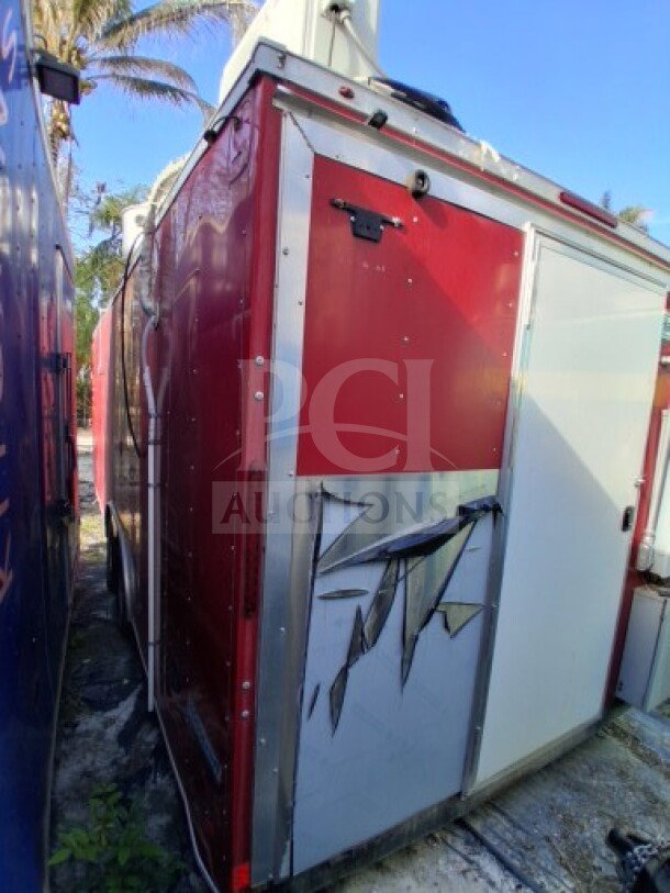 2021 Haulmark 8.5' x 24' Mobile Kitchen Trailer, dual-axle, with visible exterior damage.