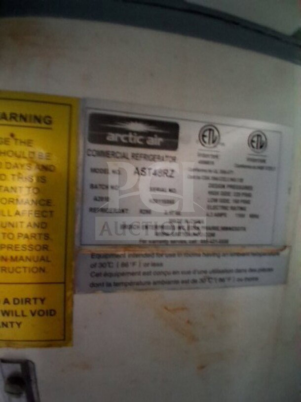 2021 Haulmark 8.5' x 24' Mobile Kitchen Trailer tag shows Arctic Air model AST48R2 refrigeration details and safety warnings.