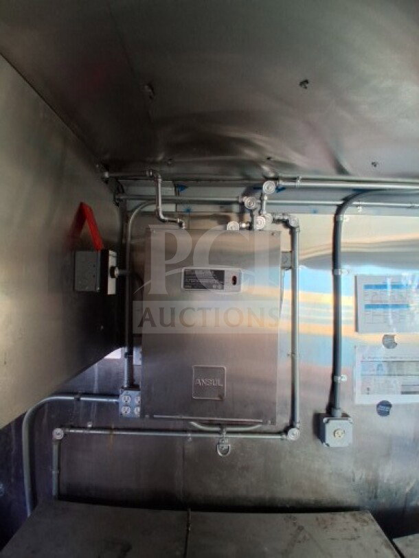 2021 Haulmark 8.5' x 24' Mobile Kitchen Trailer interior, showing a stainless steel ANSUL fire suppression system and piping.