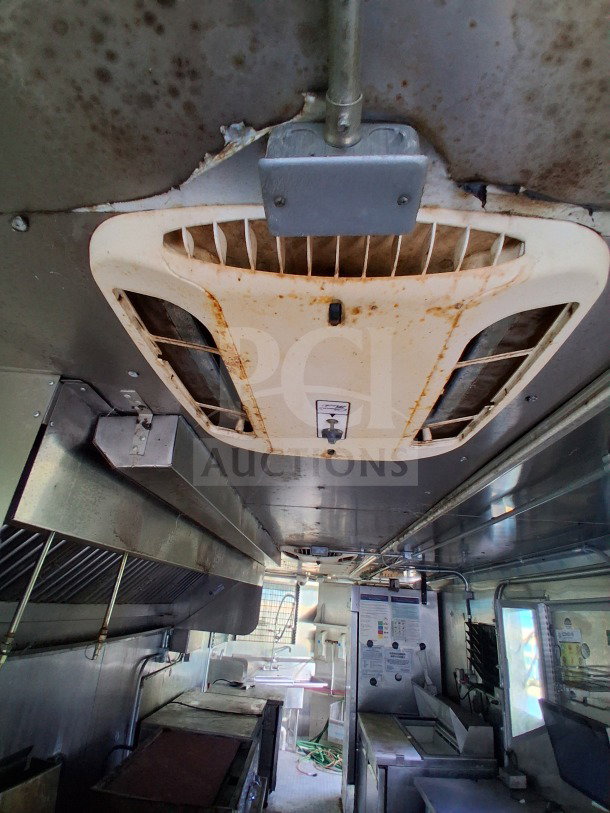Interior of 2021 Haulmark 8.5' x 24' Mobile Kitchen Trailer. Features Arctic Air refrigeration, exhaust hood, and sanitation sink.