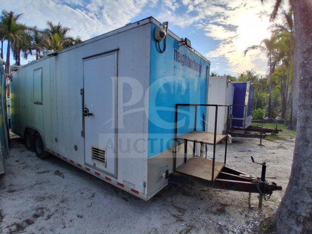 Diamond Cargo 24' mobile kitchen trailer, white and blue exterior, labeled "neighborhood," equipped for high-volume service.
