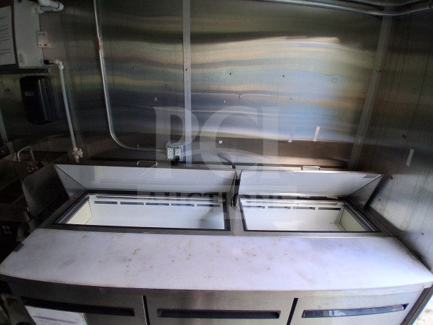 2021 Diamond Cargo 24' Custom Mobile Kitchen interior with stainless steel, Arctic Air Refrigeration, and dual fryers.
