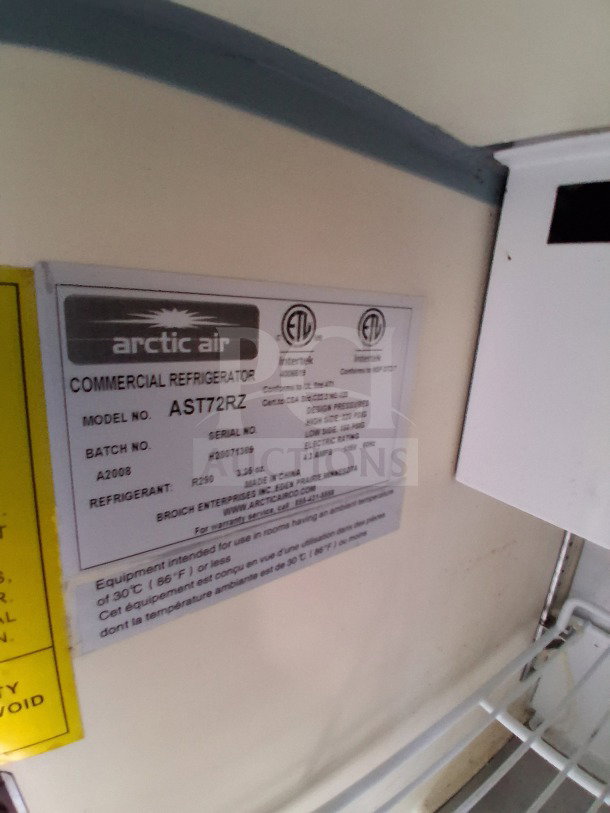 Arctic Air refrigeration label inside 2021 Diamond Cargo 24' custom mobile kitchen, model AST72RZ, showcasing commercial-grade specifications.