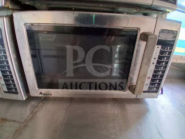 Amana commercial microwave oven in a 2021 Diamond Cargo 24' Custom Mobile Kitchen, showing keypad and handle.