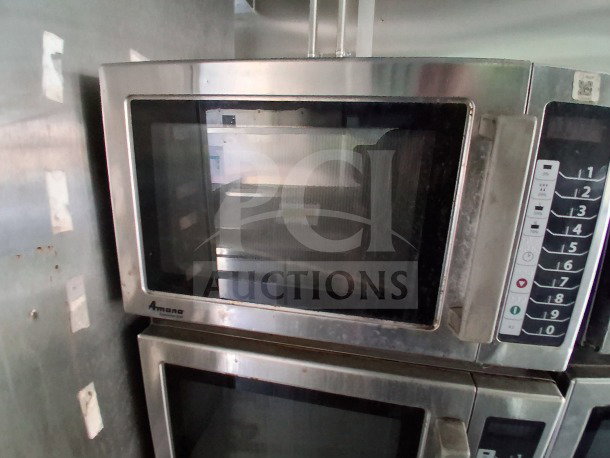 Amana commercial microwave in Diamond Cargo mobile kitchen, stainless steel, keypad with numbered buttons, used condition.