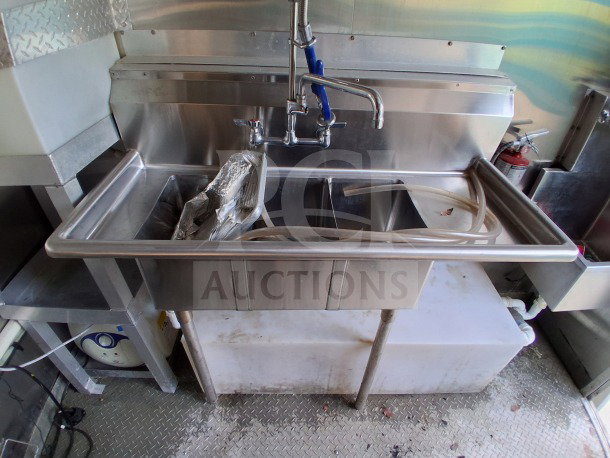 Stainless steel triple sink with faucet in 2021 Diamond Cargo 24' Custom Mobile Kitchen. Clean, excellent condition.