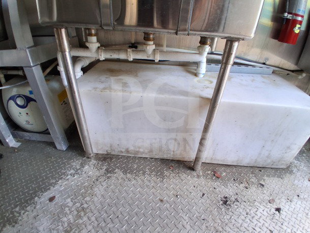 Interior of 2021 Diamond Cargo 24' Custom Mobile Kitchen featuring stainless steel sink and visible plumbing.