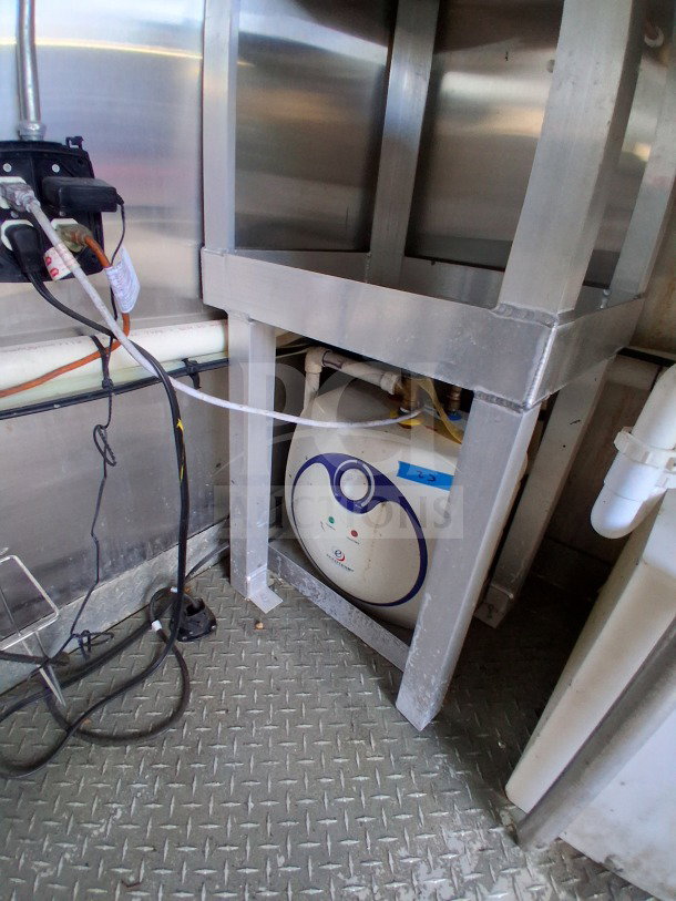 2021 Diamond Cargo 24' Custom Mobile Kitchen interior view, featuring stainless steel build and equipment setup. LOT-107.