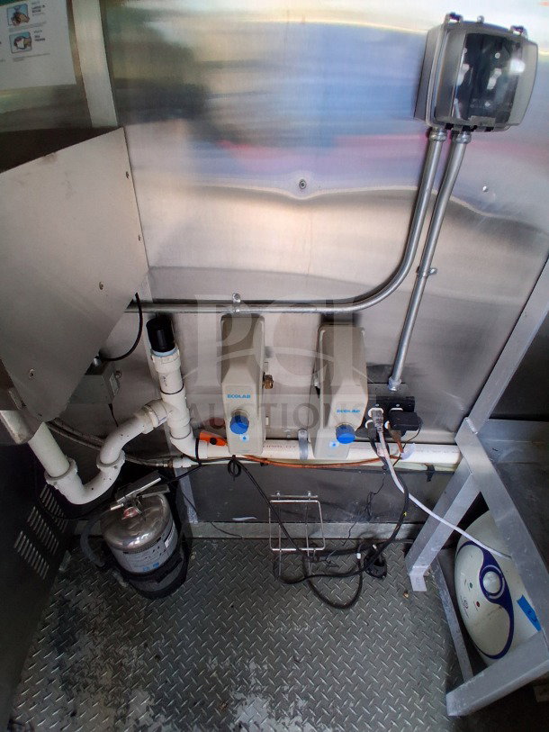 2021 Diamond Cargo 24' Custom Mobile Kitchen interior with Ecolab dispensers, stainless steel surfaces, and fire extinguisher.