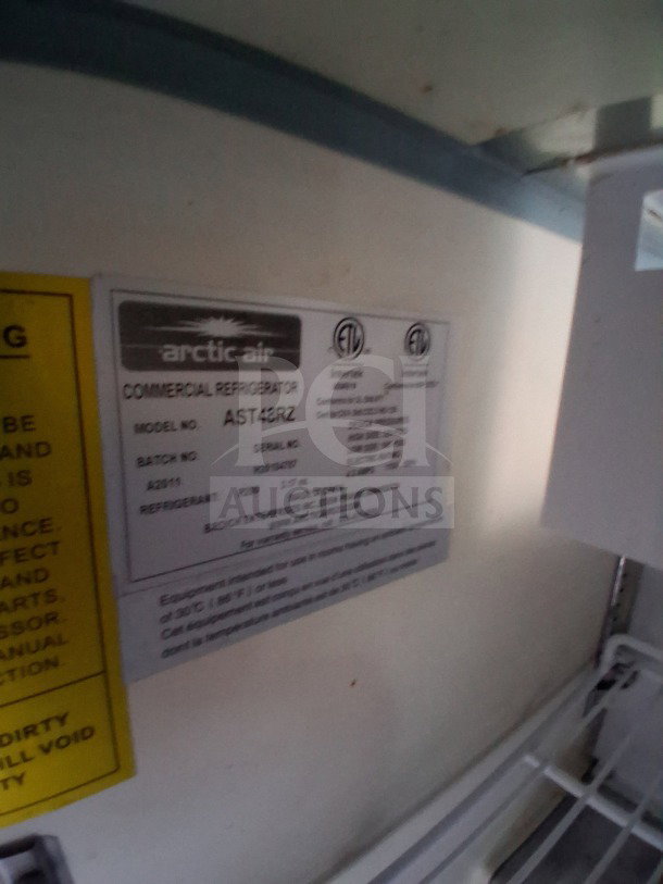 Arctic Air commercial refrigerator label, model AST48RZ, in Diamond Cargo 24' mobile kitchen. Includes specs and certifications.