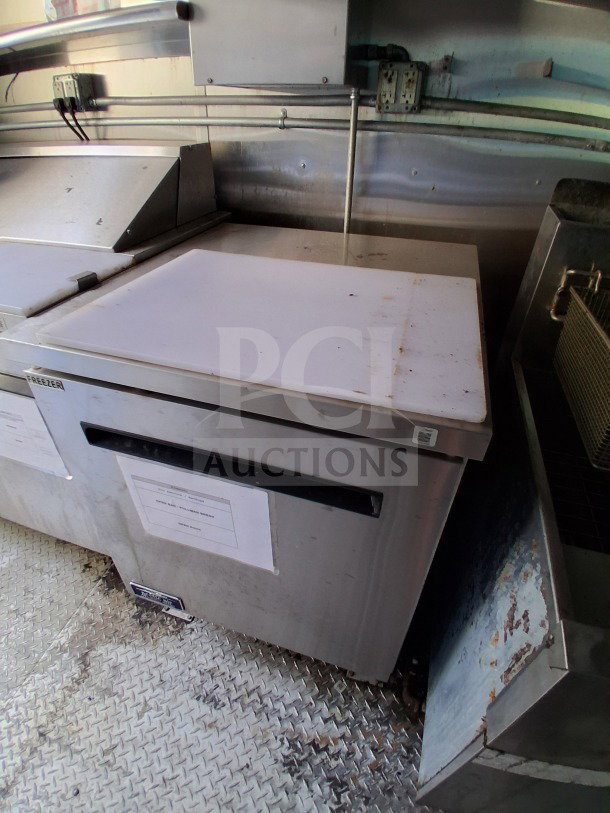 2021 Diamond Cargo 24' mobile kitchen interior, featuring Arctic Air Refrigeration, visible stainless steel surfaces, and Diamond Cargo label.