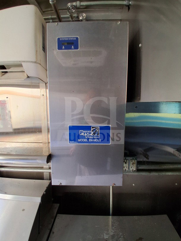 Pyro-Chem fire suppression system inside 2021 Diamond Cargo 24' Custom Mobile Kitchen, Model EN-MCU3, with system status panel.