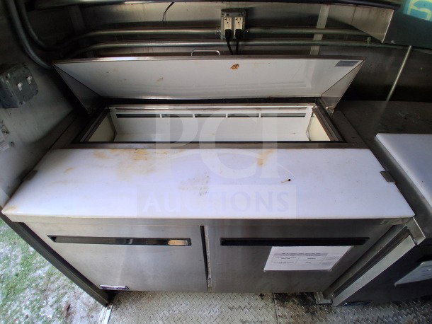 2021 Diamond Cargo 24' Mobile Kitchen with stainless steel Arctic Air fridge, showcasing interior workspace, LOT-107.