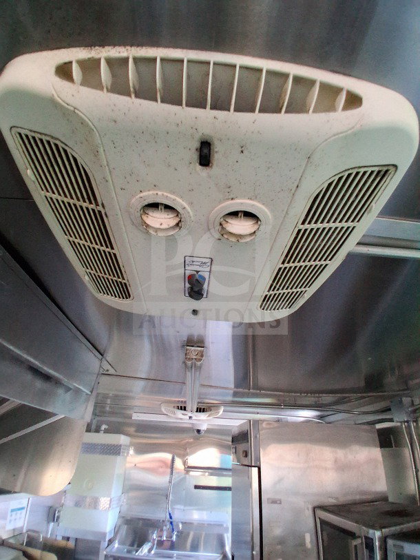 2021 Diamond Cargo 24' Mobile Kitchen interior, featuring stainless steel surfaces and Arctic Air Refrigeration Package.