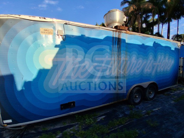 2019 Quality Cargo food trailer, large graphics, equipped with grease hood, dual fryers, griddle, and Atosa refrigeration.