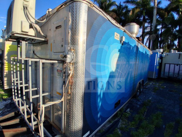 2019 Quality Cargo Food Trailer, blue exterior, features large order window, grease hood, dual fryers, griddle, Atosa refrigeration.