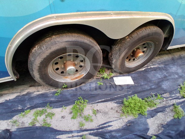 2019 Quality Cargo Food Trailer wheels. Visible wear and rust. Includes large order window and complete Atosa refrigeration suite.