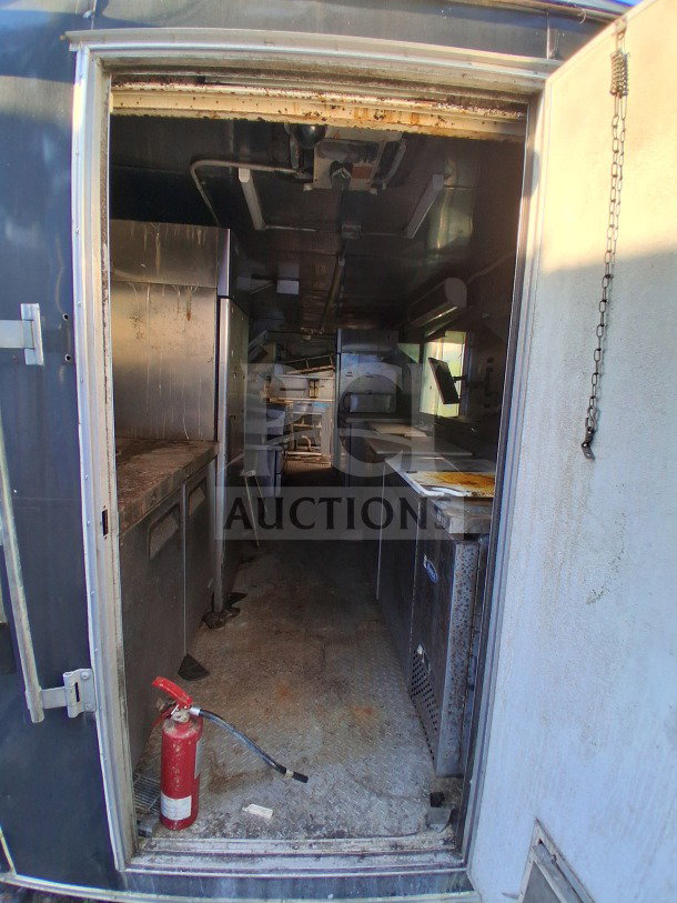 2019 Quality Cargo food trailer with kitchen, grease hood, fryers, griddle, cooktop, Atosa refrigeration. Used condition.