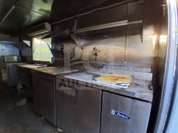 2019 Quality Cargo Food Trailer, commercial kitchen with Atosa refrigeration, grease hood, dual fryers, griddle, cooktop.