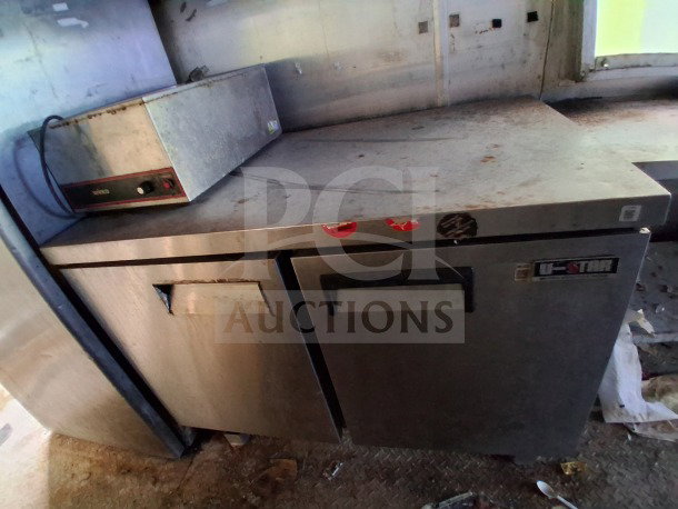 2019 Quality Cargo Food Trailer with Atosa refrigeration suite, grease hood, dual fryers, griddle, and burner cooktop.