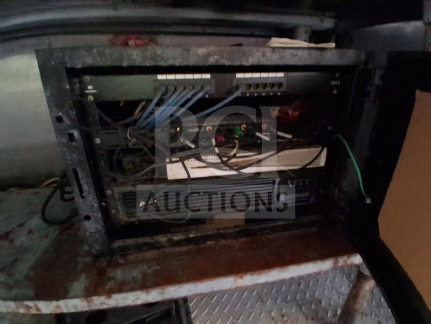 Commercial kitchen trailer interior showing wiring setup; part of a 2019 Quality Cargo Food Trailer equipped with kitchen appliances.