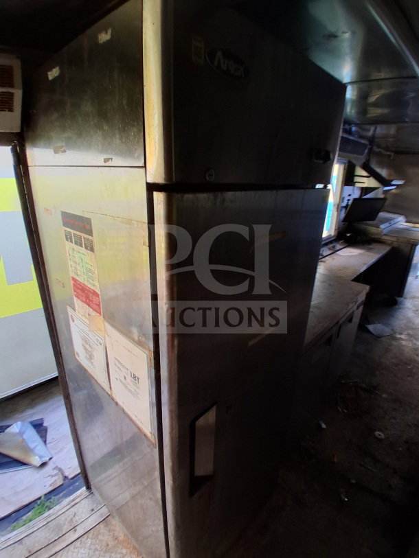 2019 Quality Cargo Food Trailer with Atosa refrigeration, grease hood, fryers, griddle, cooktop. Features a large order window.