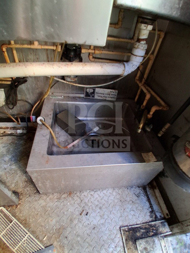2019 Quality Cargo Food Trailer interior with plumbing, dual fryer, griddle, grease hood. Includes Atosa refrigeration. LOT-110.
